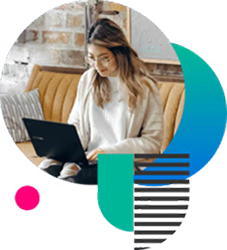 Girl sitting on a sofa with a laptop on her lap